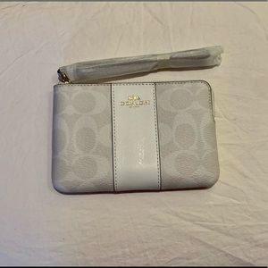 white coach corner zip wristlet